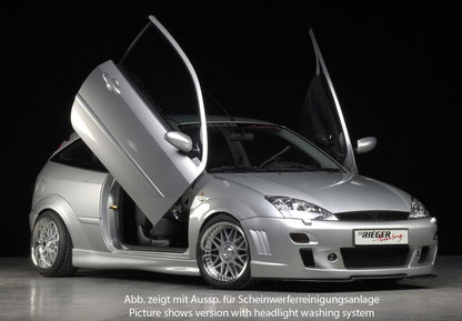 Ford Focus 1 Rieger Spoilerstoßstange -> bis Modell 10/2001 mit Aussparung für Blinkleuchten, mit seitlichen Rippen, ABS, 
inkl. Alugitter, Montagezubehör, ABE